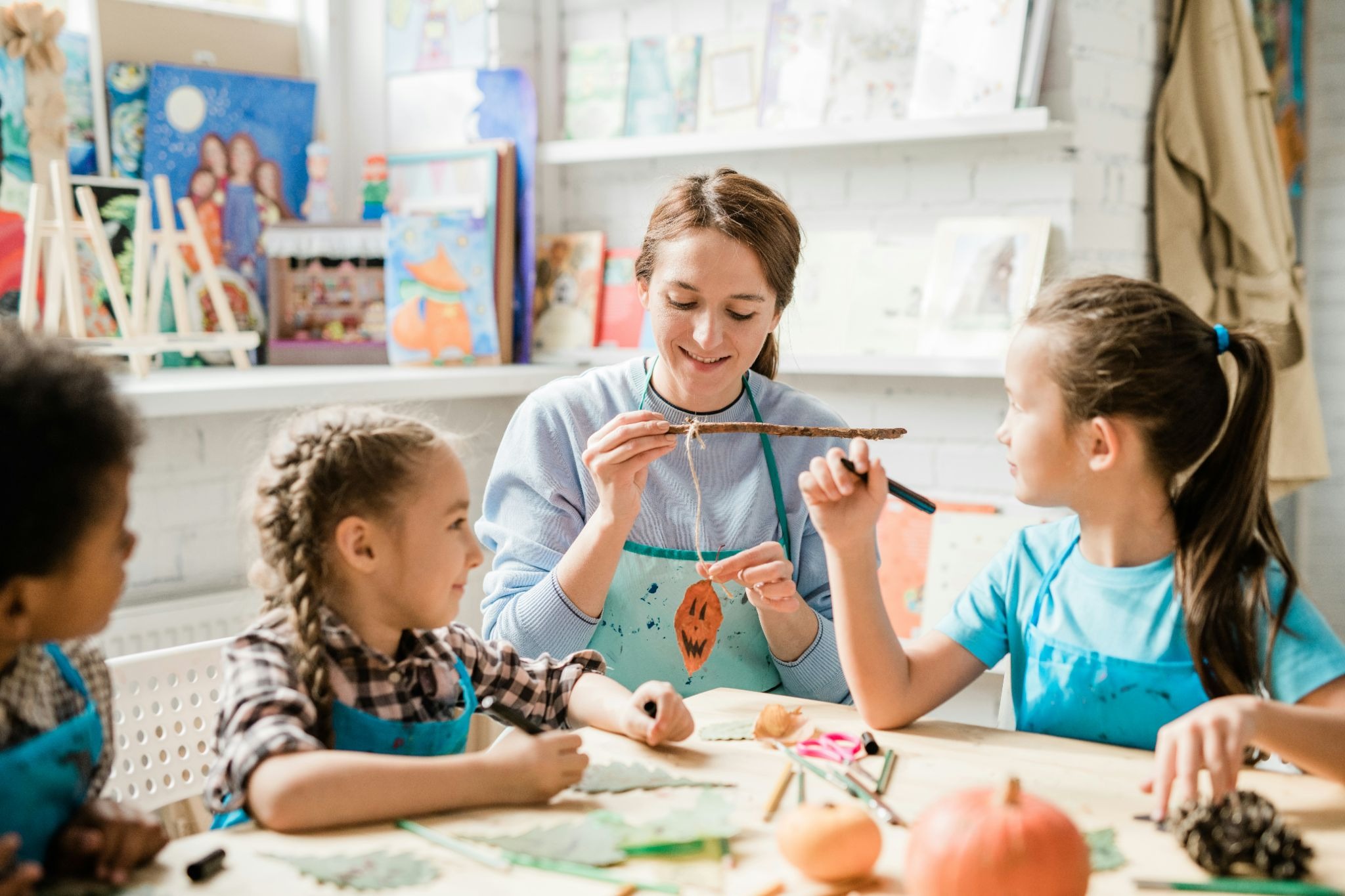 Instructor in a children’s activity center with young kids