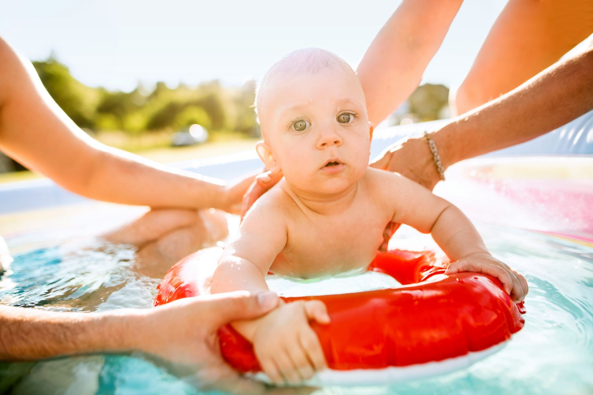 Baby learning to swim with swim safety gadgets