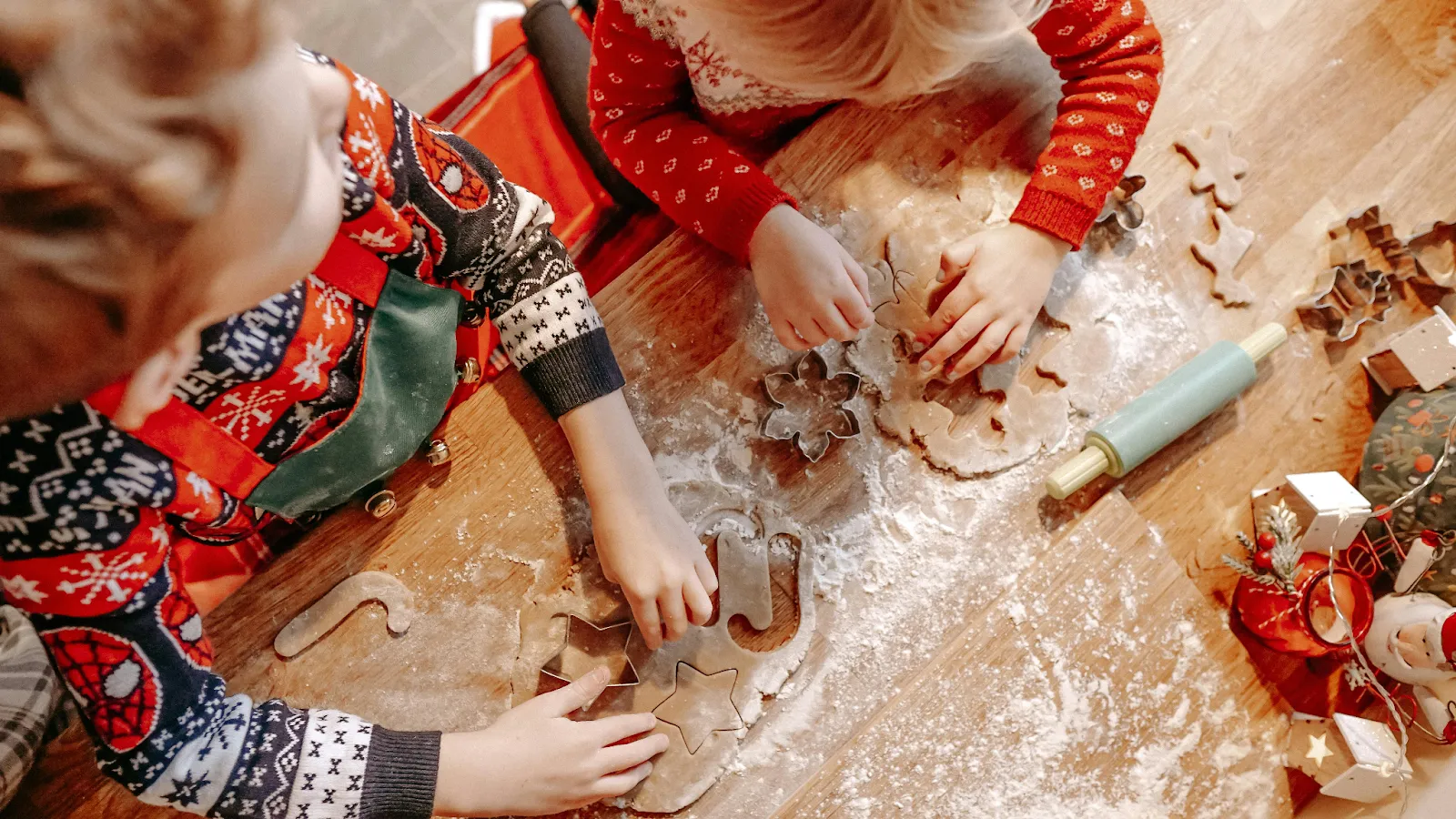 Kids teamming up to decorate cookies