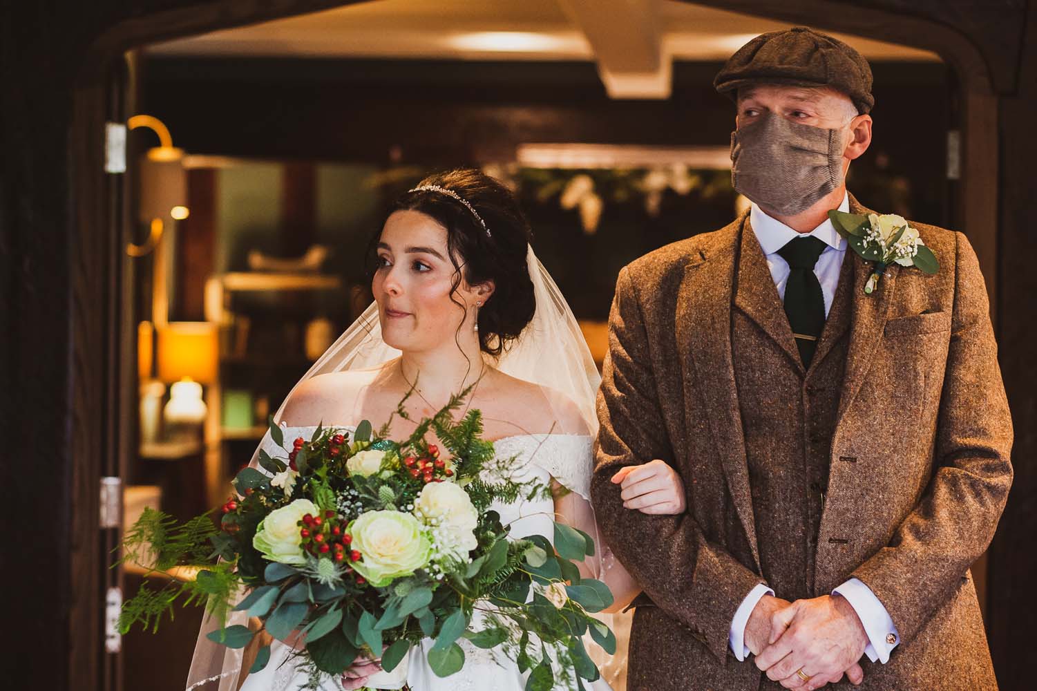 Bride walking down the aisle with her dad at her Peaky Blinder themed  wedding 