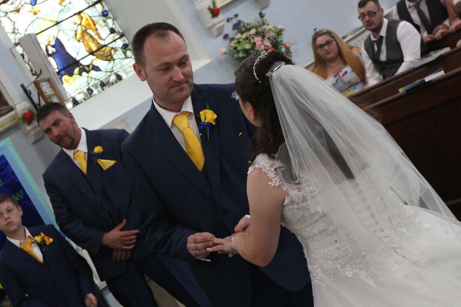 A bride and groom as they say I do