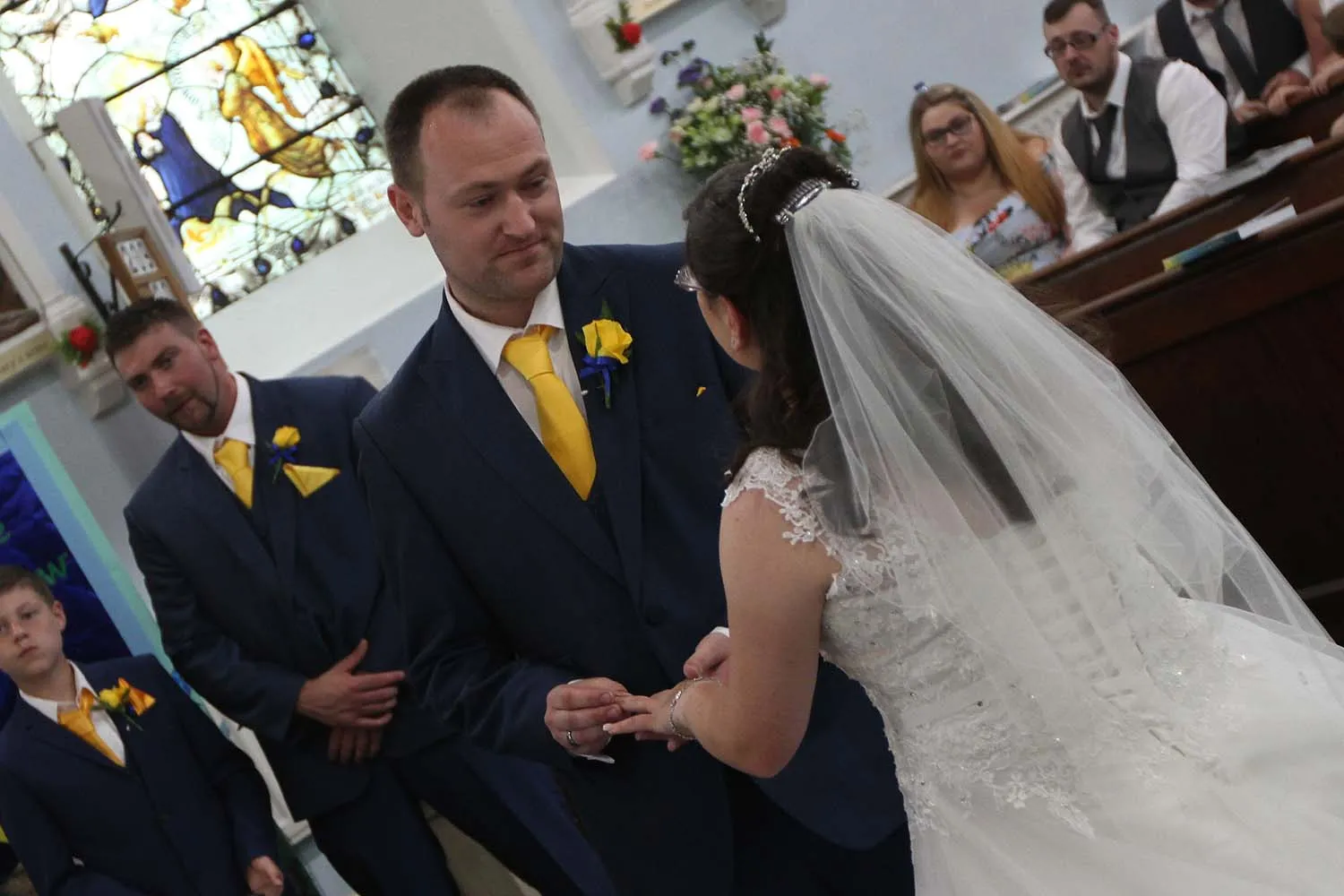 A bride and groom as they say I do
