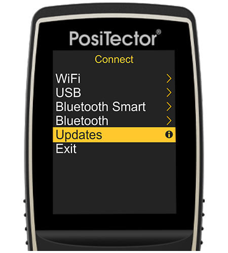 Image of a PosiTector gage body, the screen shows the Connect menu with the 'Updates' option selected