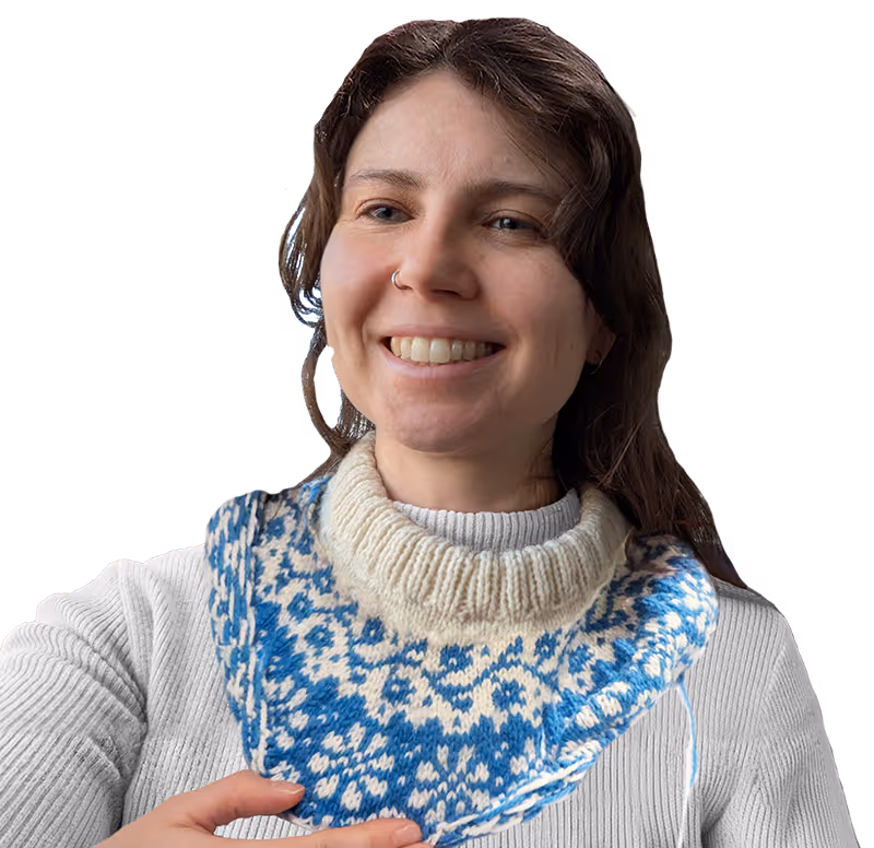 Photo of Cat Johnson wearing a hand-knitted jumper