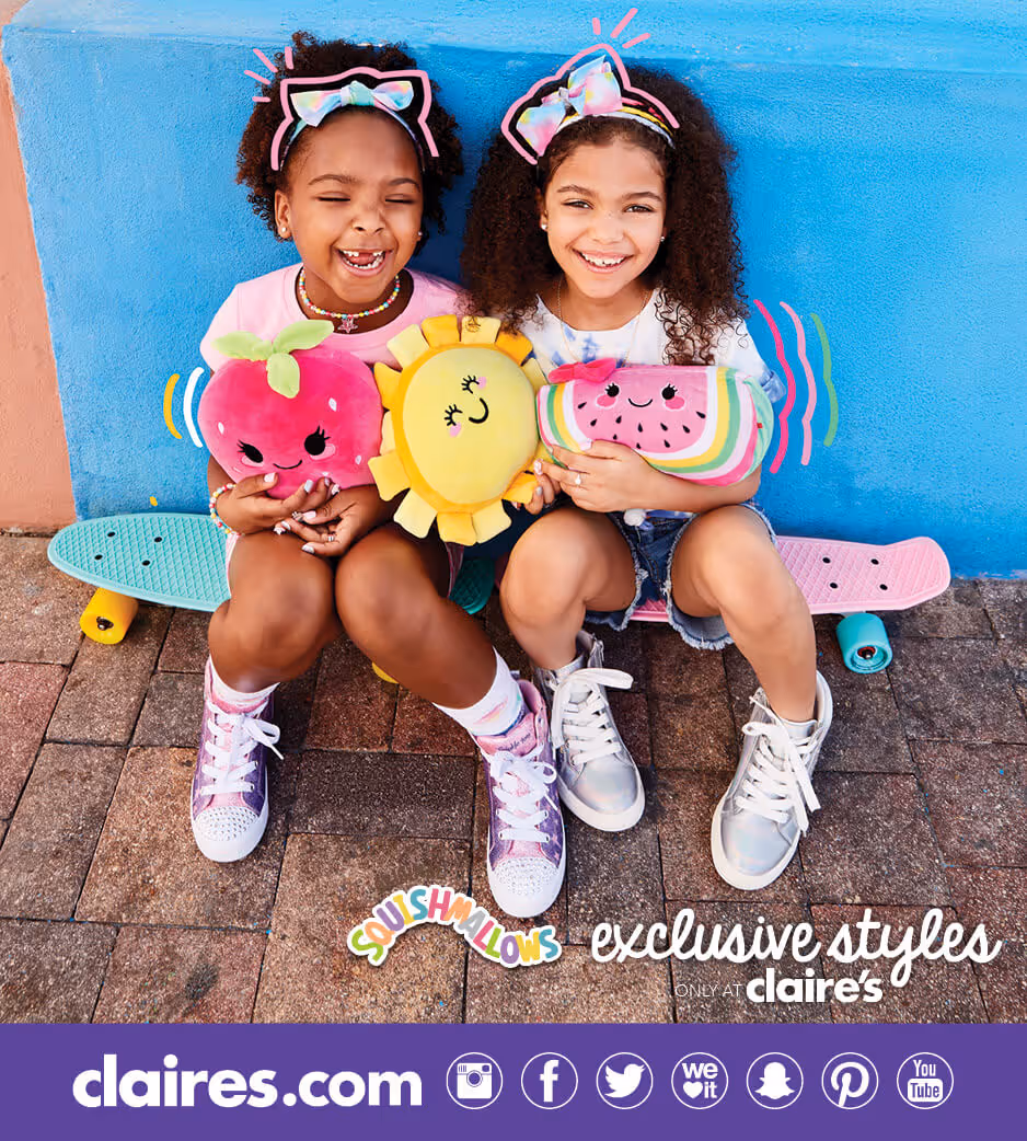 Two young girls wearing Claire's headbands holding plush toys