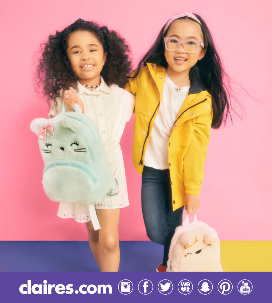 Two young girls with animal backpacks from Claire's