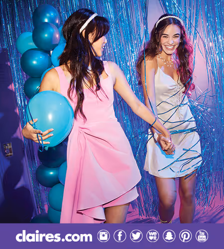 Two teen girls at a homecoming dance wearing Claire's accessories