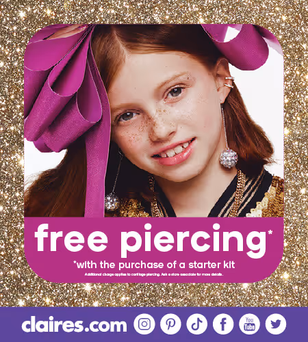 Young girl with large hair bow and three ear piercings