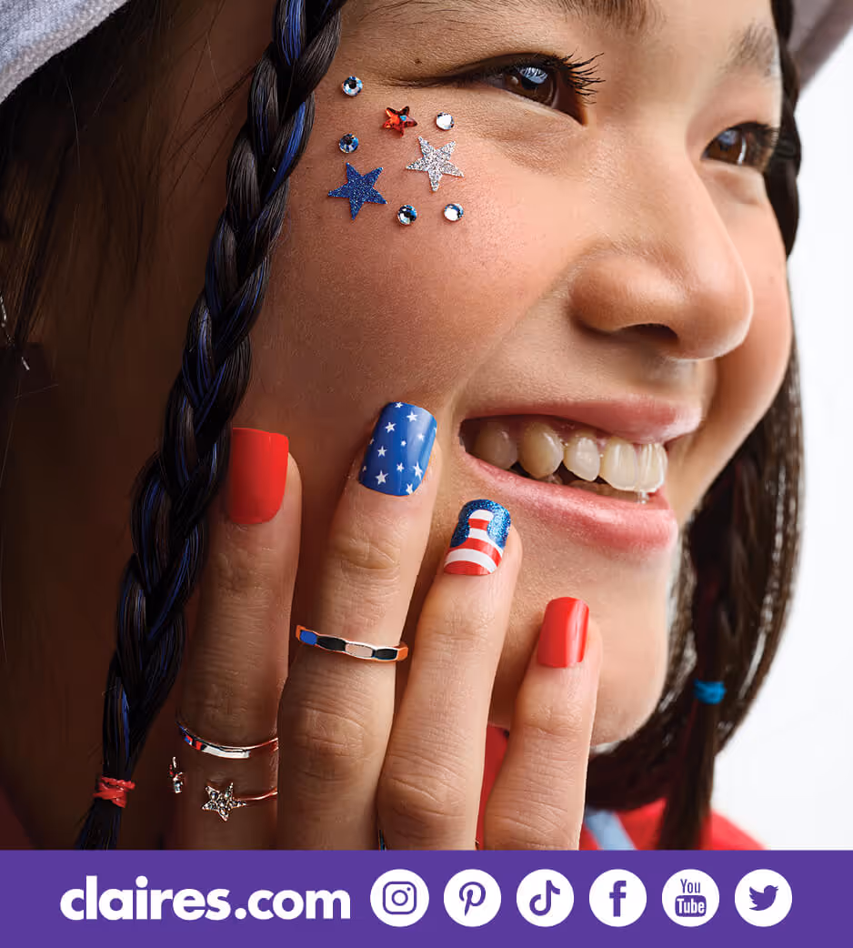 Young woman smiling with patriotic accessories