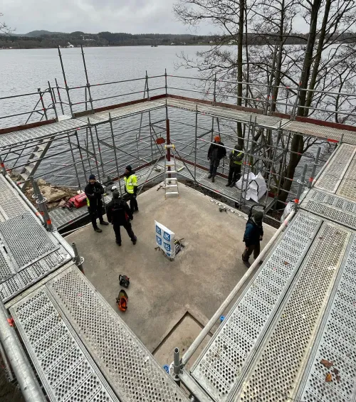 Blindspace builders contractors waterfront pavilion aerial with workers and scaffolding