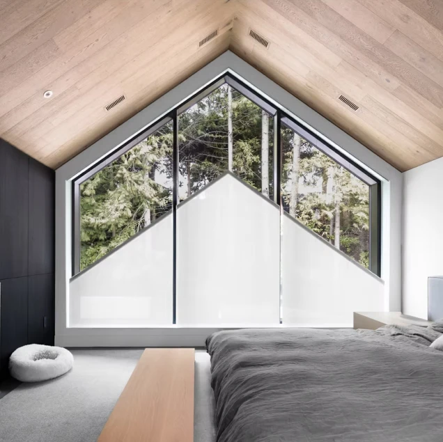 Blindspace slanting gable window roller blind in vaulted bedroom