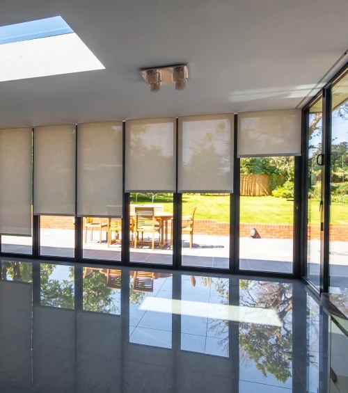 Blindspace roller blind with bifold glass doors garden rooflight