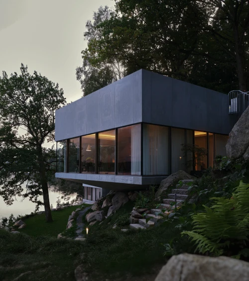 Blindspace glass pavilion waterfront dusk rocks forest stairs