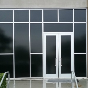 Blackout window tint on commercial building.