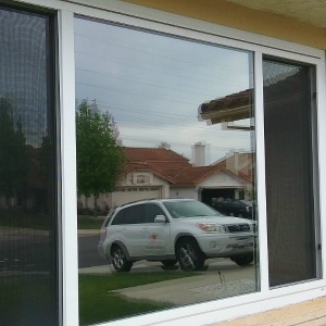 Image of reflective window film on residential building.