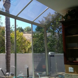 Image of reflective window film on residential building.