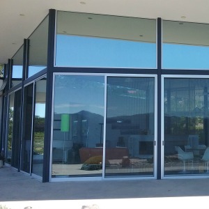 Image of reflective window film on residential building.