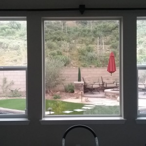 Picture of medium tint installed next to clear glass to see the difference.