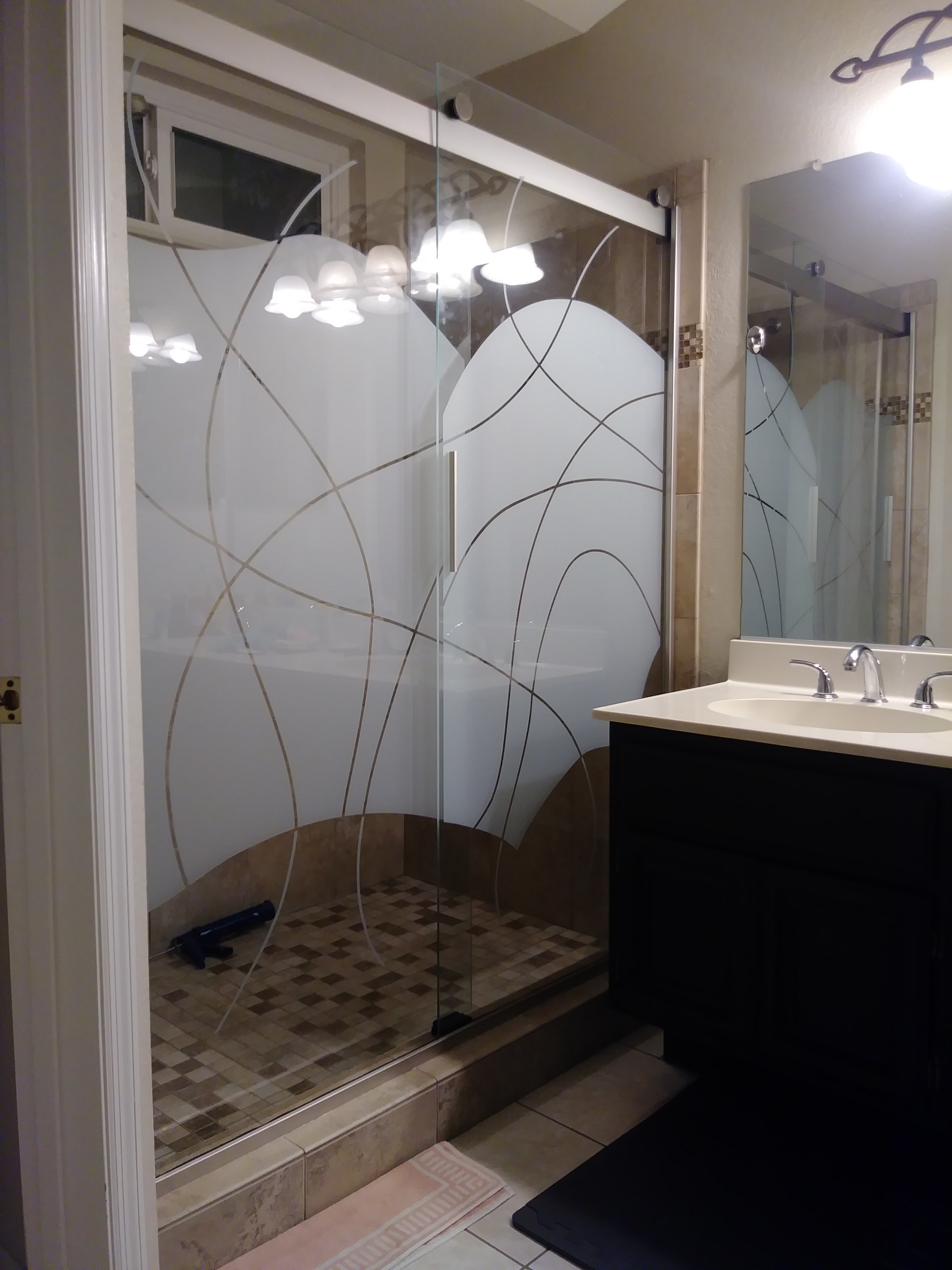 Photo of overhead glass in shower being tinted to reduce incoming heat.