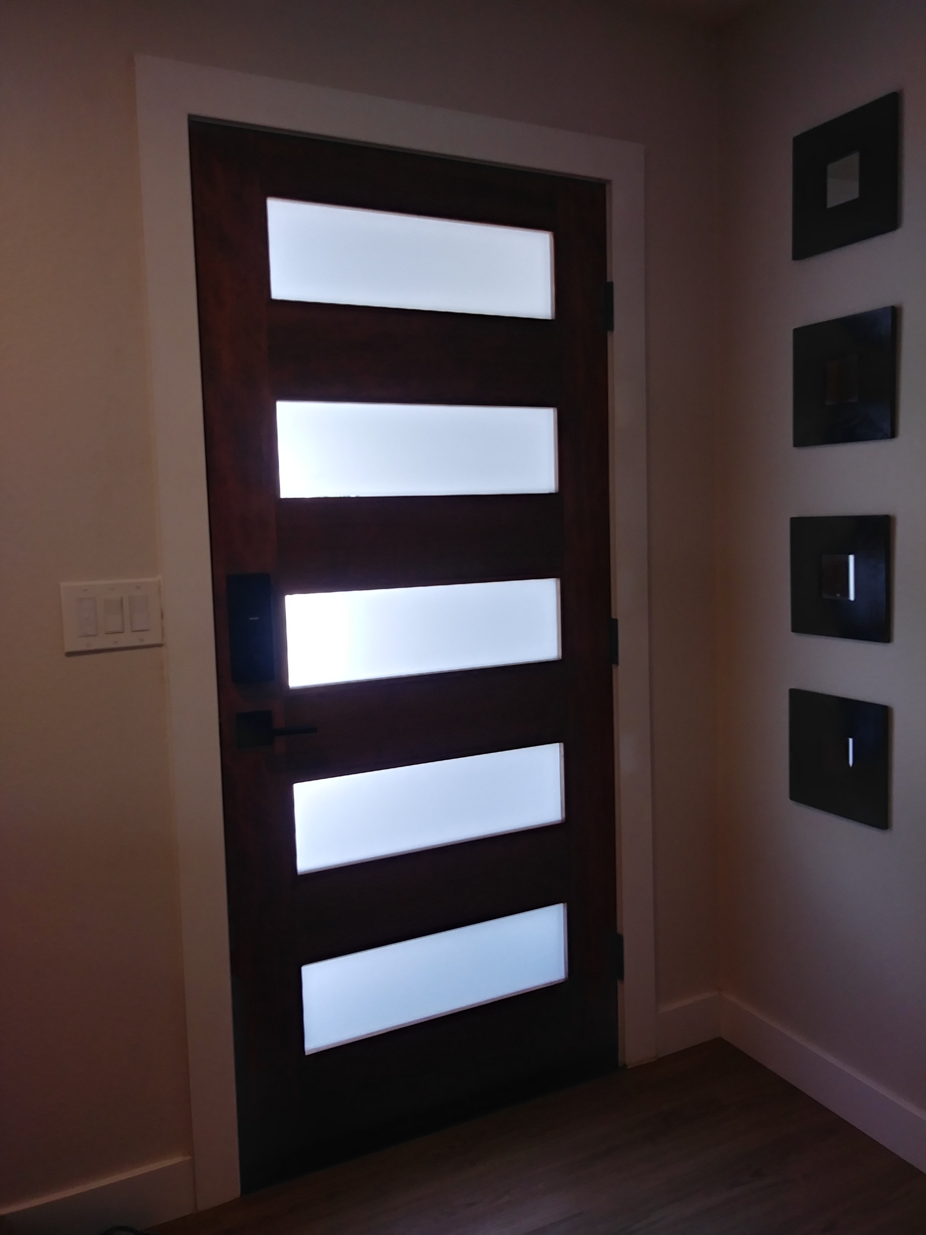 Image of decorative partition on all glass door adding style and privacy.