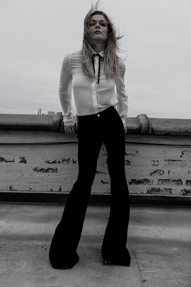 Rimes rose to stardom at age 13 following the release of her version of the Bill Mack song "Blue," becoming the youngest country music star since Tanya Tucker in 1972.