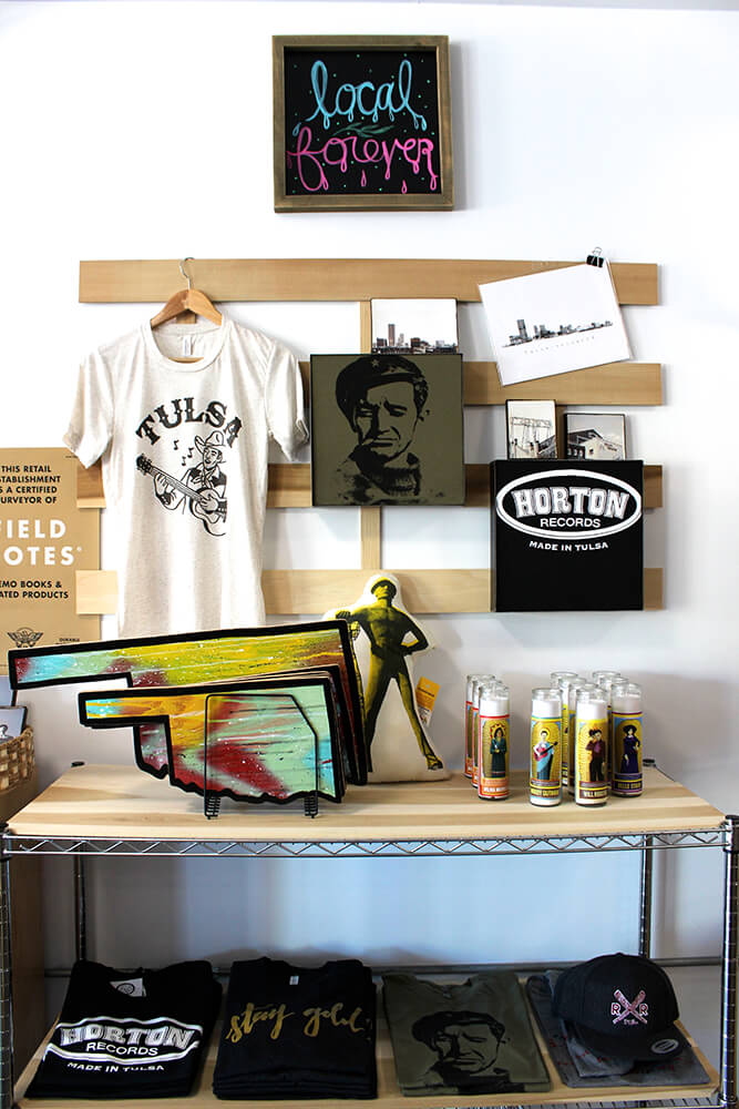 While you’re sipping your coffee, you can enjoy perusing the amusing goods including fun ribbons, T-shirts, and of course, plenty of Okie Bigfoot gear. (Photo: Valerie Grant)