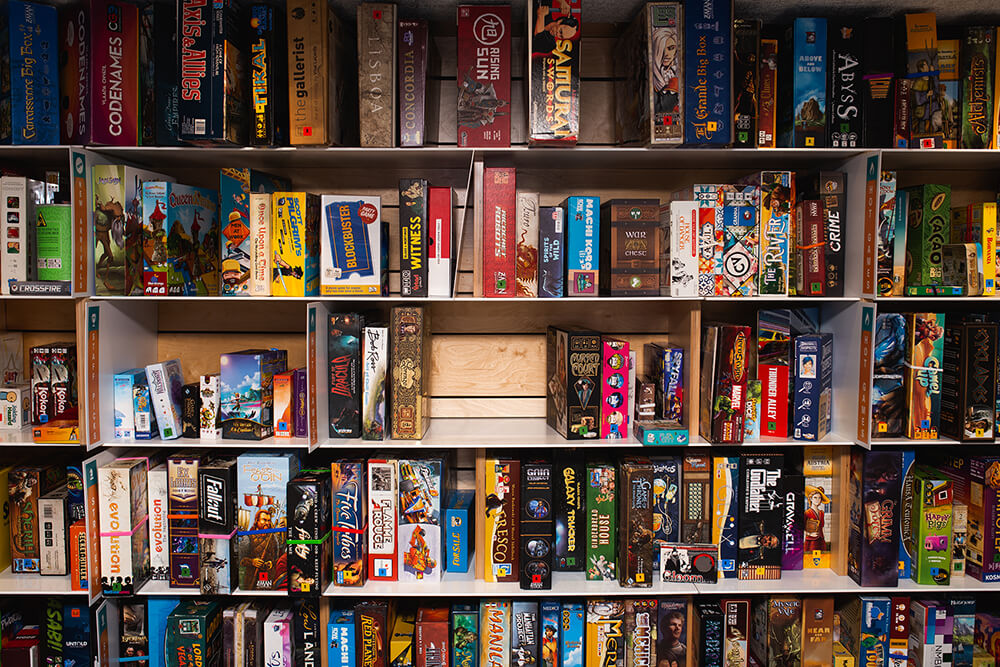 Customers can select from an extensive board game library that contains over 700 titles. (Photo: Sarah Eliza Roberts)