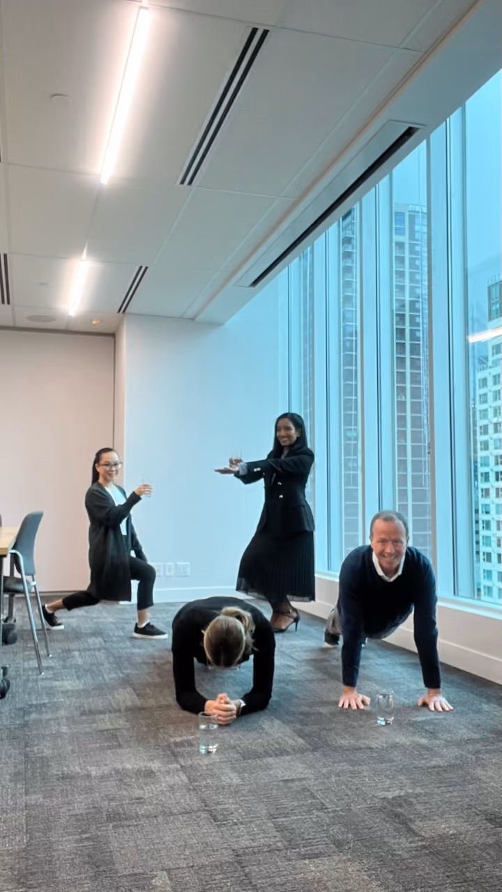 Employees planking in one of our wellness challenges