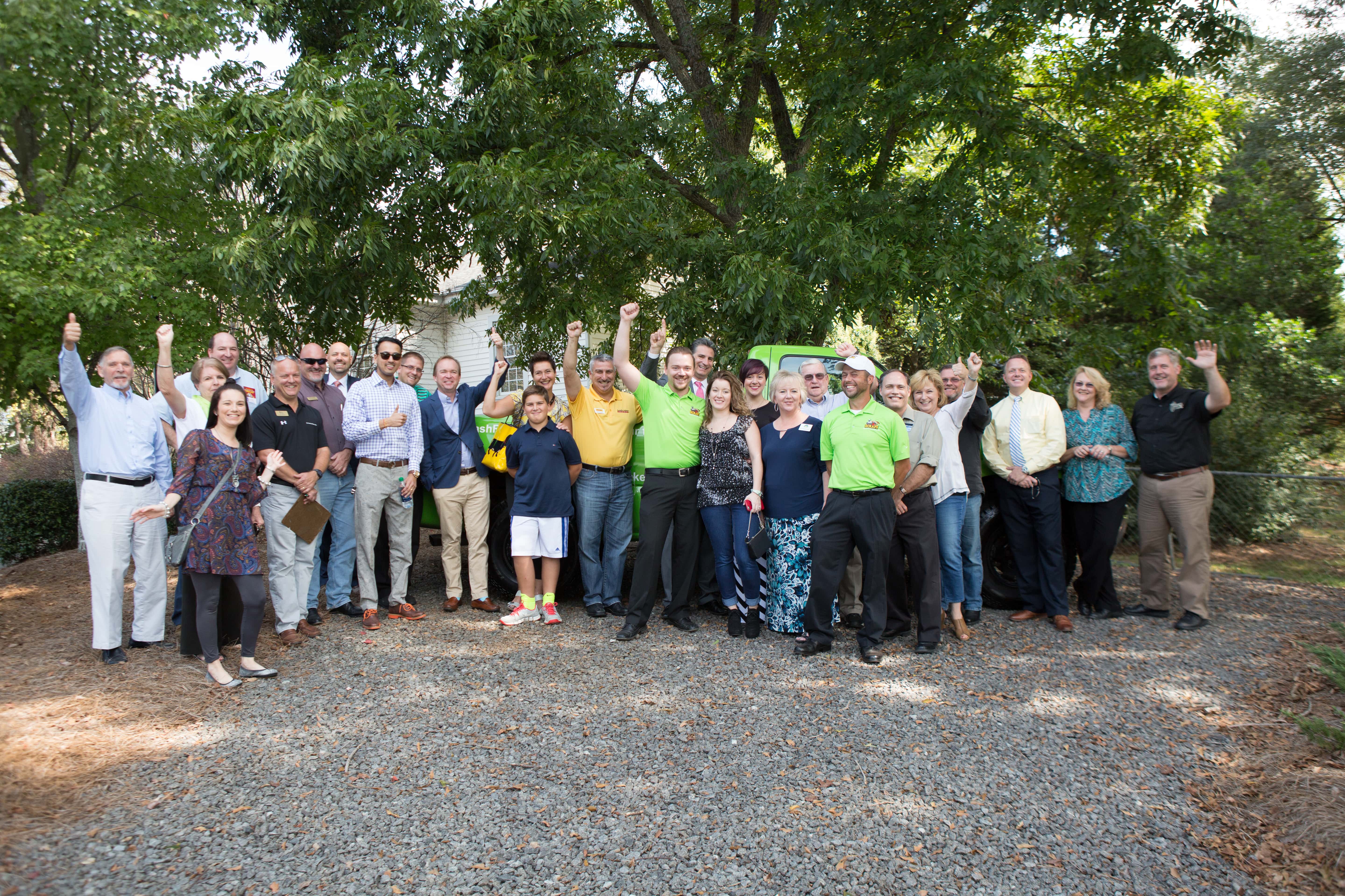 Large group of attendees and supporters celebrating Scraps Trash Removal’s ribbon-cutting in York County.