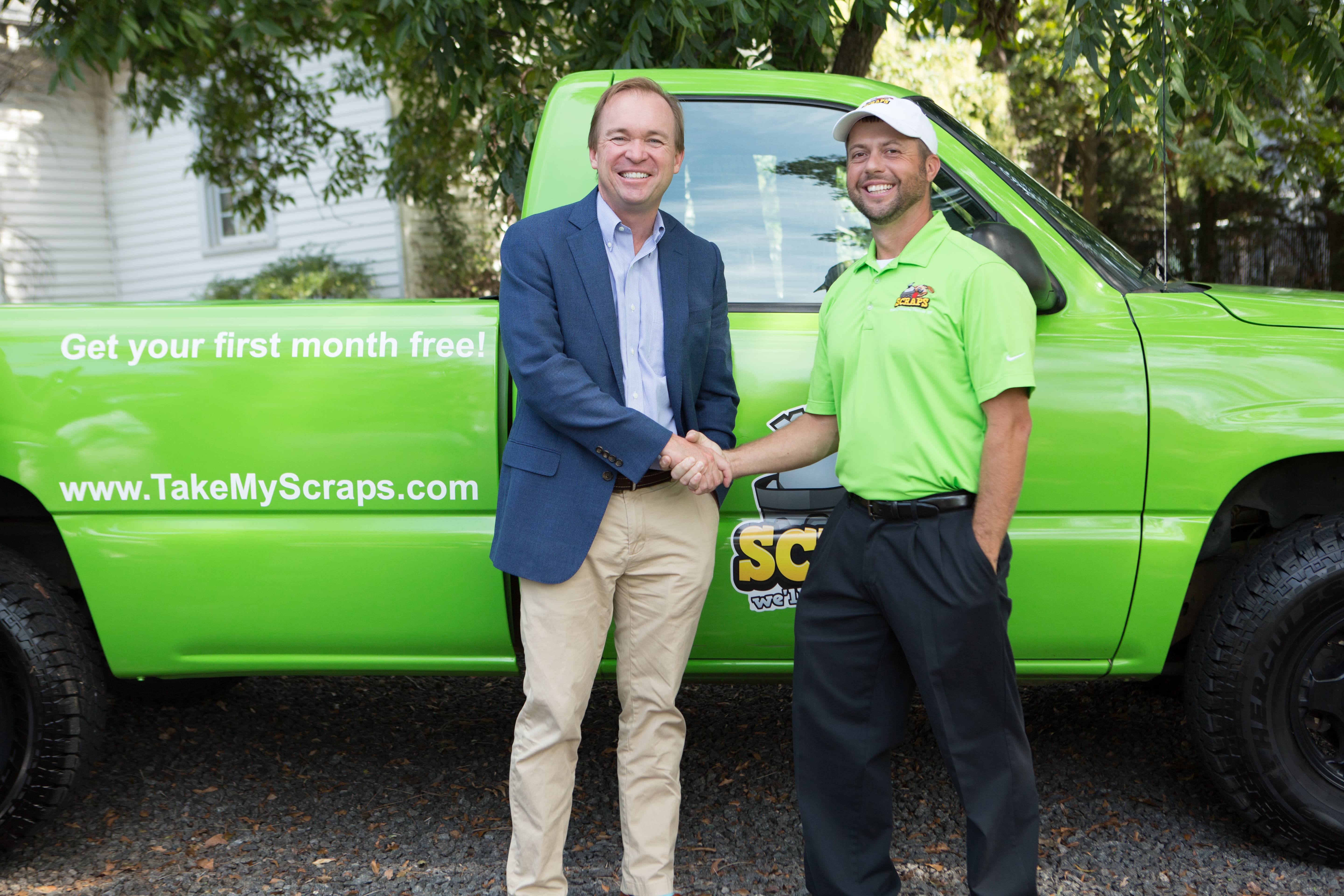Scraps co-founder and Congressman Mick Mulvaney smiling and shaking hands post-ceremony.