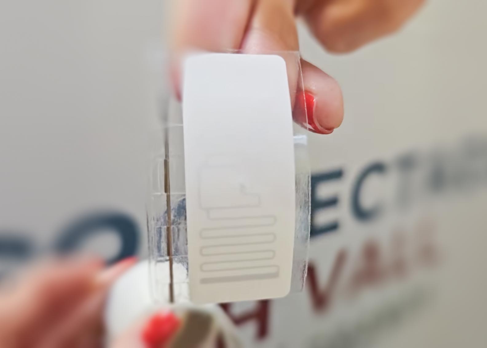 EM-RFID Label in front of a blurreed background.