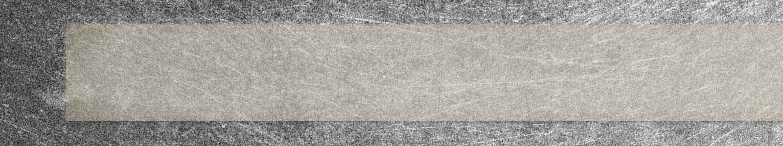 Image of a steel surface with a slightly off-white color ISO-8502-3 dust tape applied onto it
