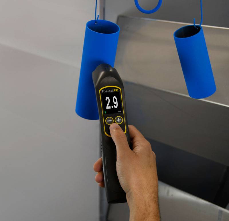 Photo of a PosiTest PC measuring pre-cure powder coating thickness