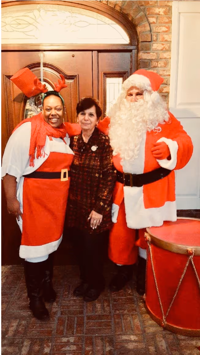Gae Pensabene posing with board member and Santa
