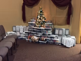 Photo of a Christmas tree with wrapped presents underneath