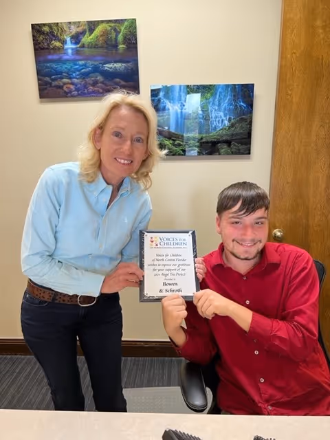 Charlene Dahlberg & Tyler Chapple representatives of Bowen & Schroth in Eustis