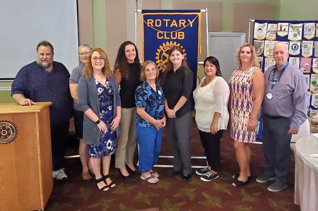 Sue Carpenter of Voices for Children pictured with Rotary Club of Inverness members