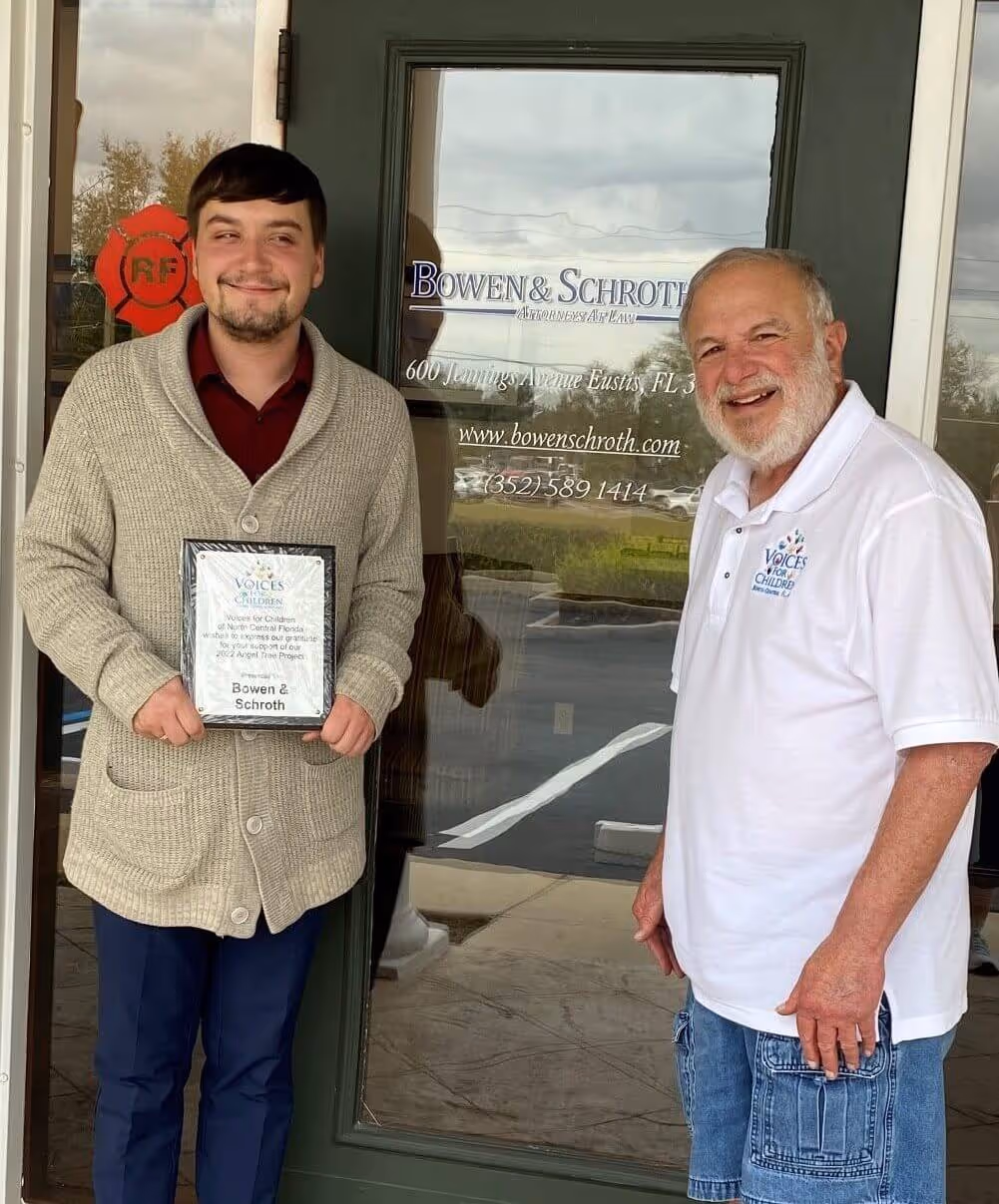 Tylor Chapple with Jeff Cohen of Voices outside the Bowen & Schroth office in Eustis