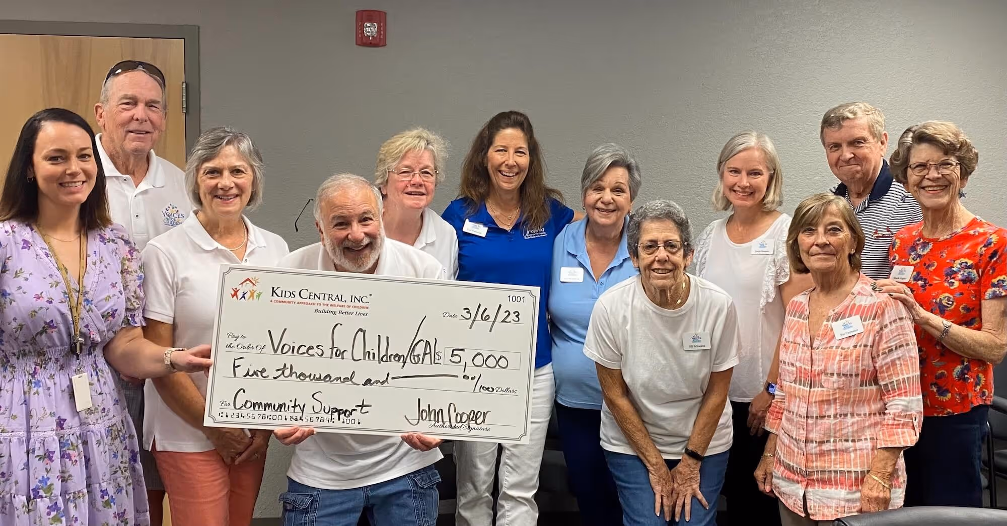 Pictured (l to r) Kimberly McGlothern of Kids Central and Alan Gouge, Jane Gouge, Jeff Cohen, Kathleen Cossey, Lori Patterson, Gae Pensabene, Jill Schwarts, Sonia Semans, Sue Carpenter, Erick Forholt and Wanda Vogler of Voices for Children.