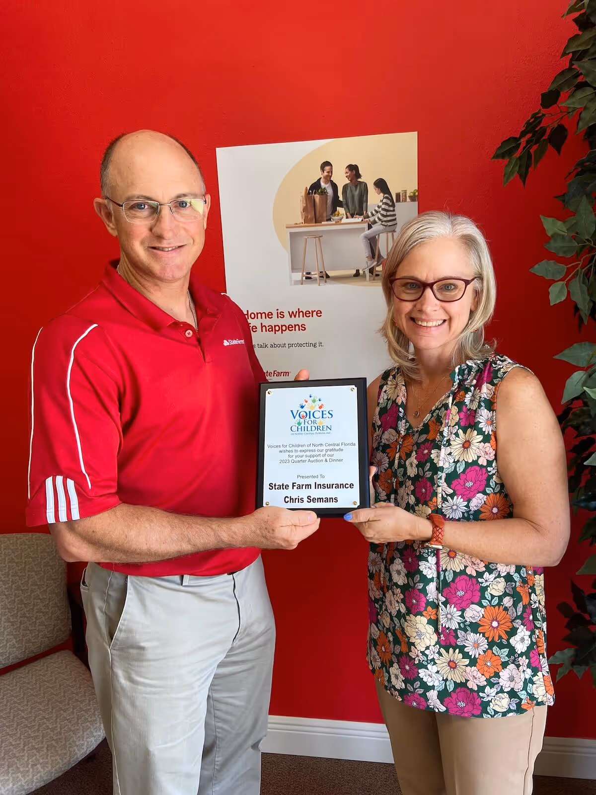 Chris & Sonia Semans holding a Voices for Children of North Central Florida thank you plaque