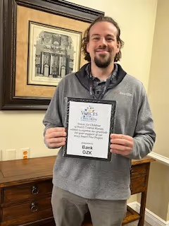 Kenneth Clark, BankOZK liaison holding appreciation plaque