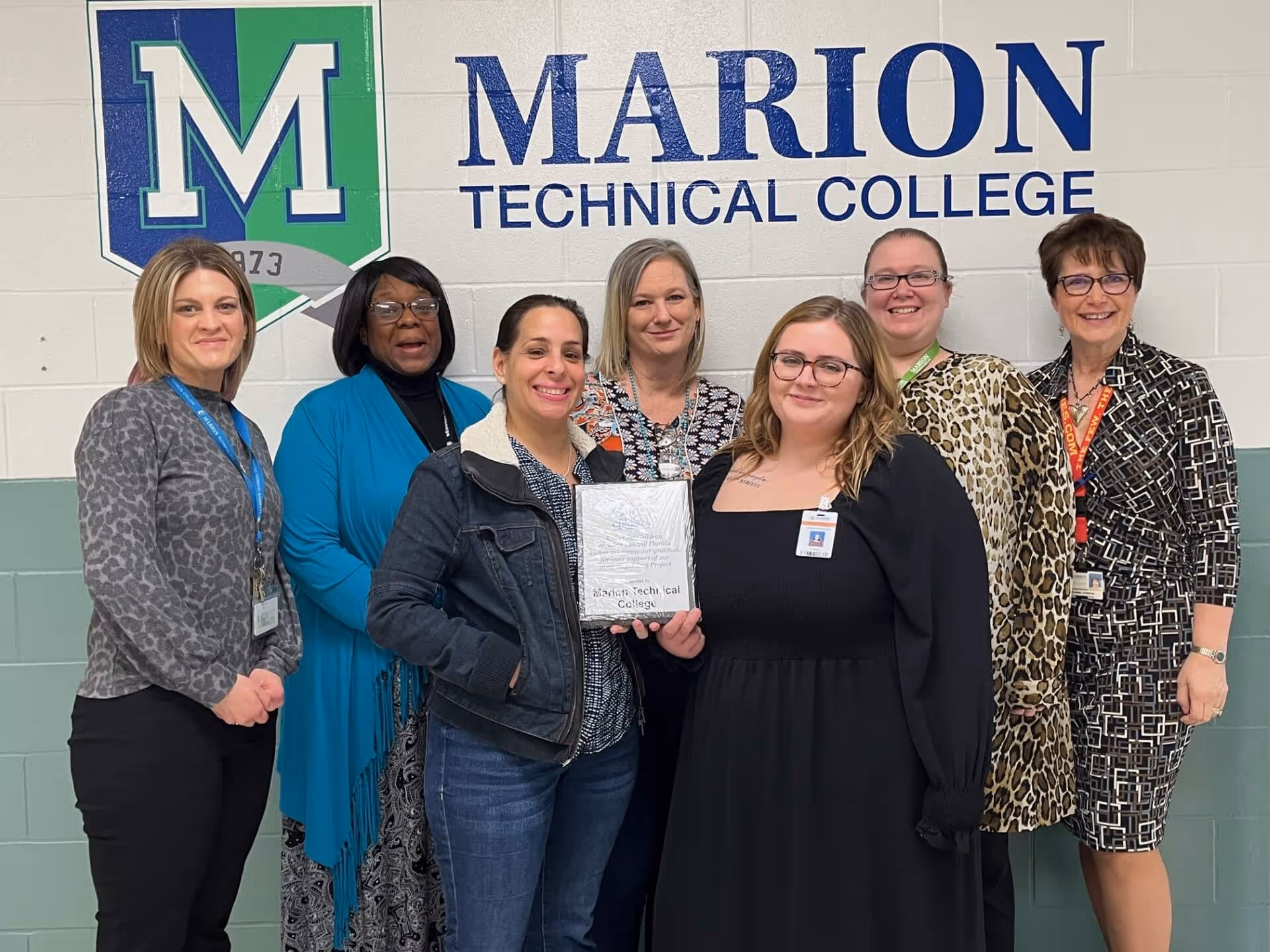 Marion Technical College staff accepting a recognition plaque