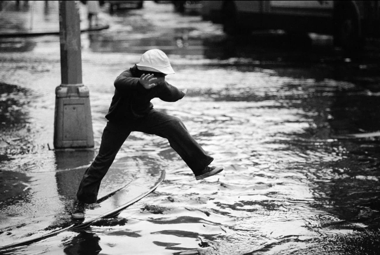 Man walks across the street, photographed by Joe McNally