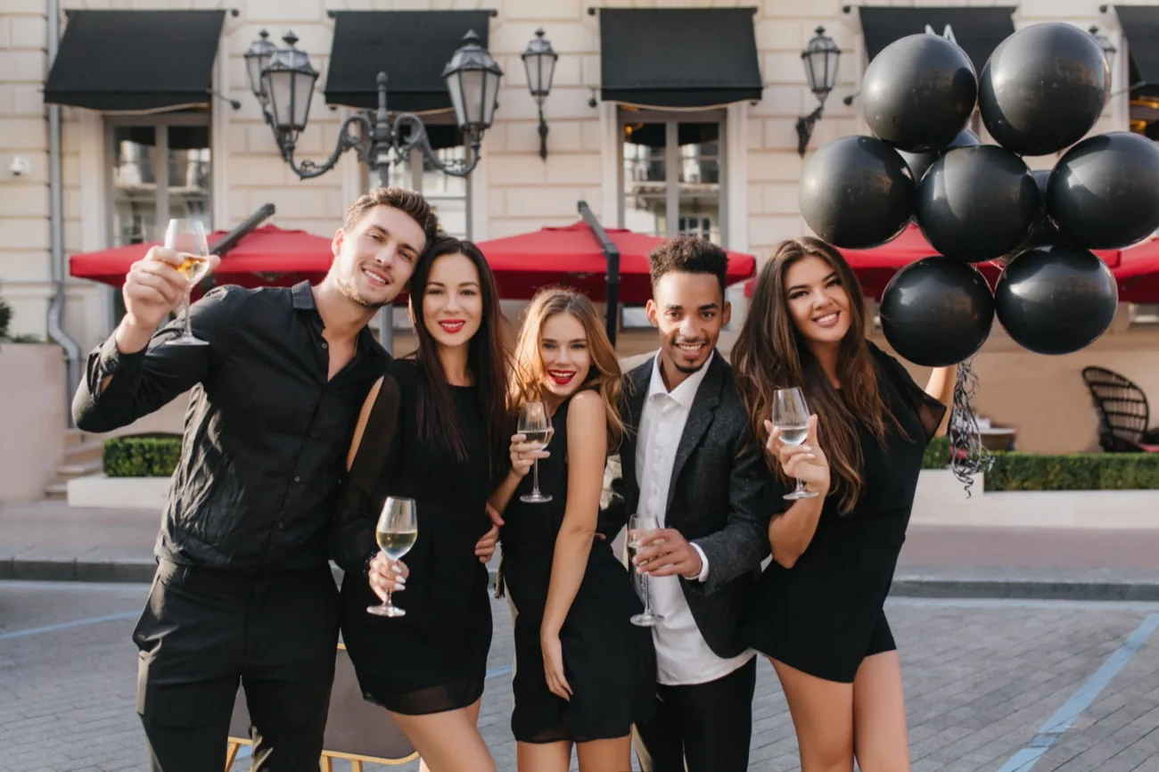 cheerful-friends-drinking-champagne-party-outdoors