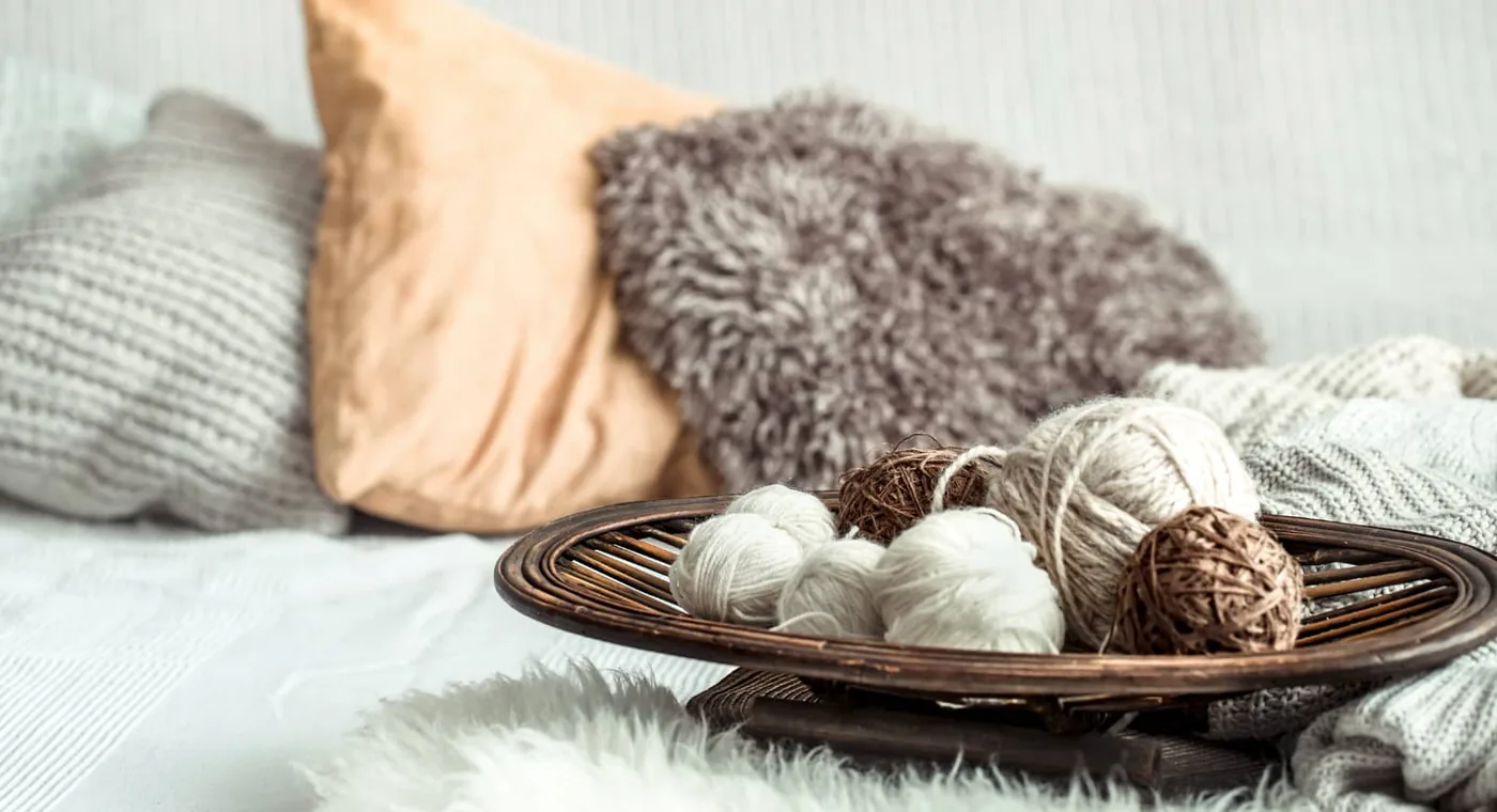 still life with a sofa and balls of yarn