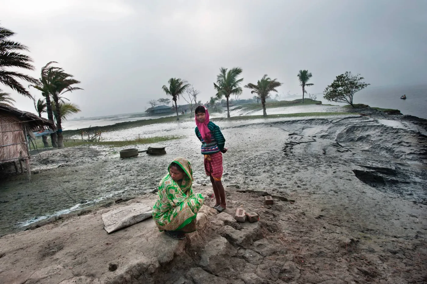Photo: © Kadir van Lohuizen – NOOR – Bangladesh 2011; two women on flooded land