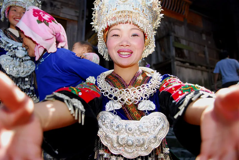 Women in colorful traditional clothes in China