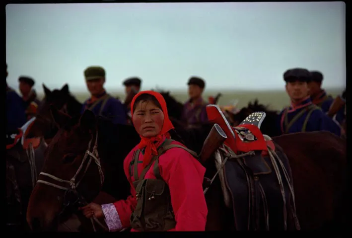 photo of men with horses in Mongolia
