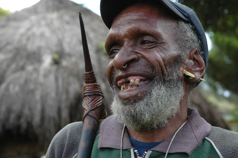 photo: Tom van der Leij - man from Irian Jaya with nose and ear piercings