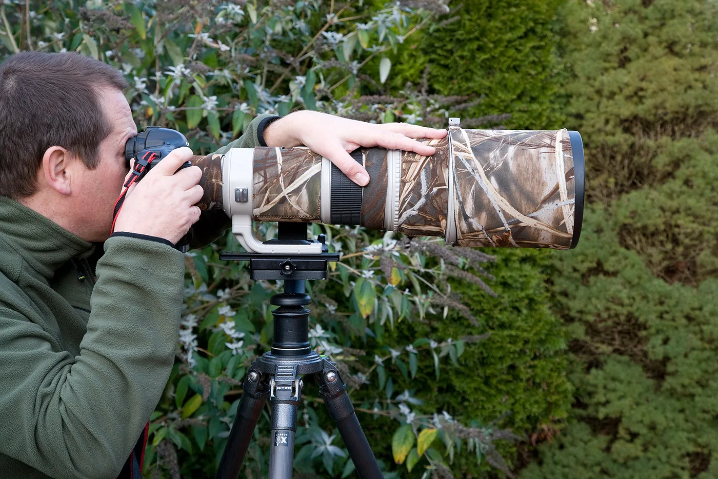 Man using a super-telephoto lens